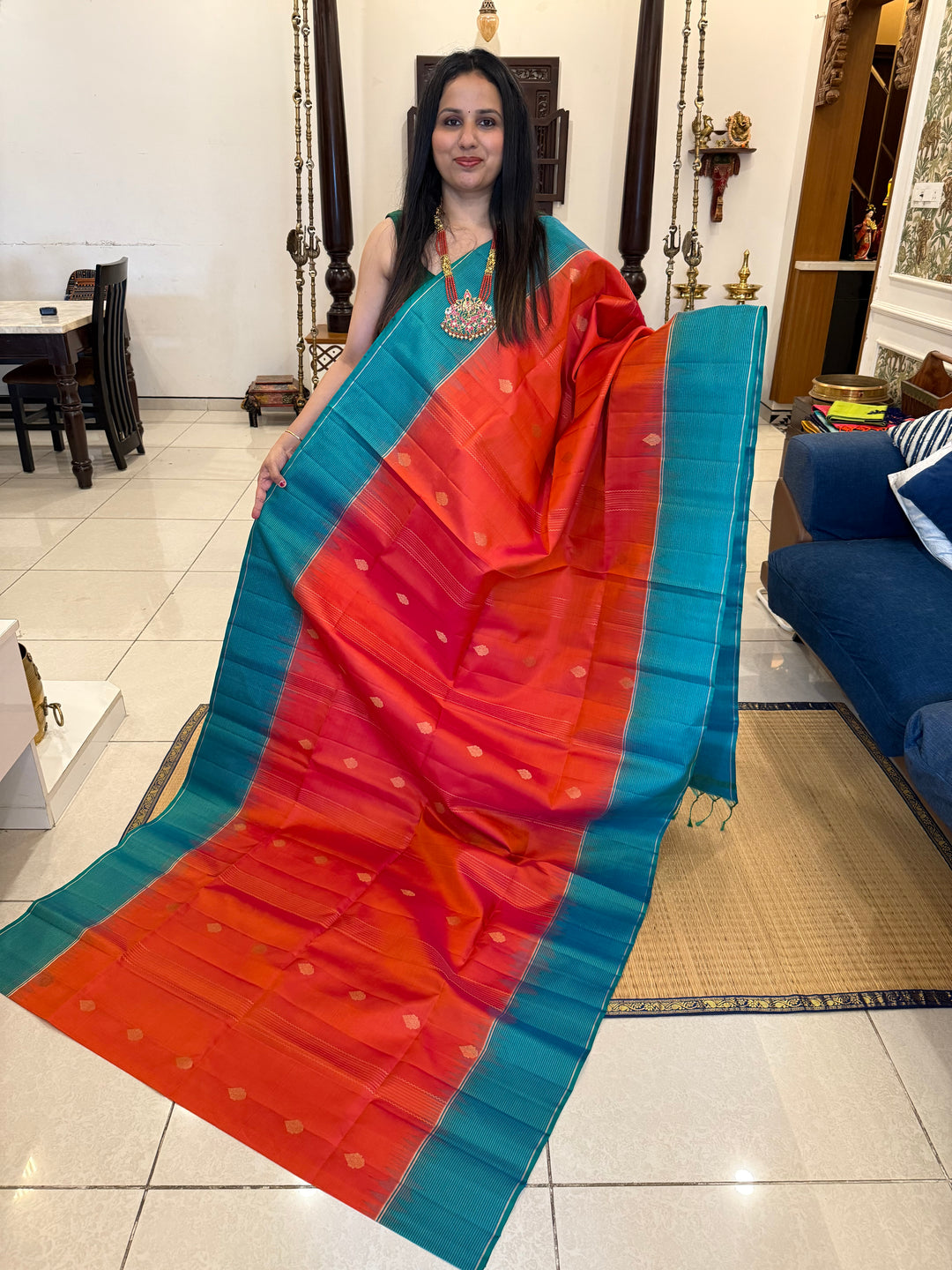 Orangish Red with Turquoise Blue, Vertical Silver and Fold Zari Lines with Rich Butta in the body and Grand Pallu Pure Soft Silk Saree