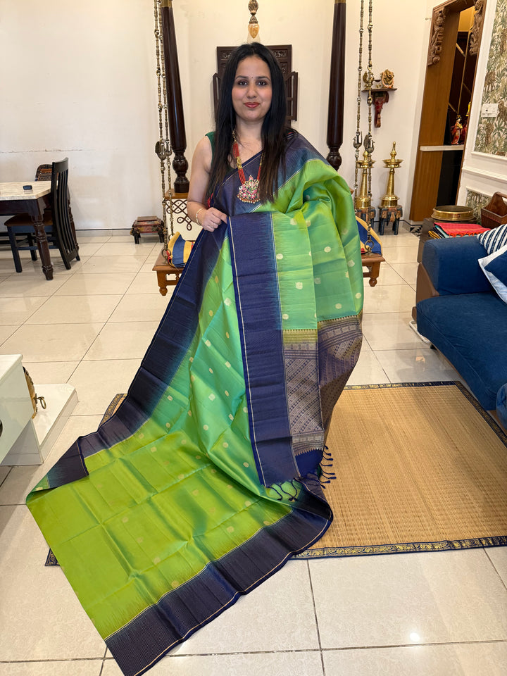 Pastel Green with Blue, Rich annam and chakram butta in the body, Vairaoosi Zari Lines in the border and Grand Pallu Pure Soft Silk Saree