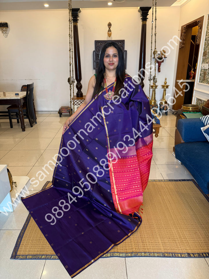 Dark Indigo Blue with Orangish Pink ,Small Zari Border, Zari butta in the Body and Grand Pallu , Pure Soft Silk Saree