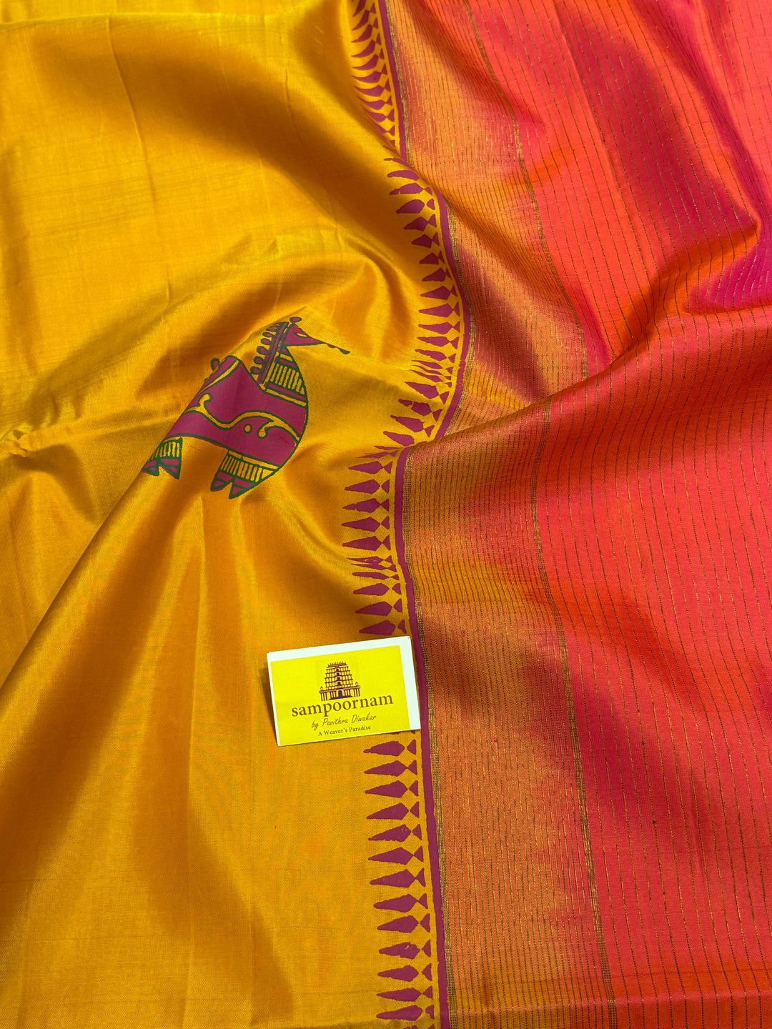 A Trendy Yellow with Pink, Handblock Printed Terracota Horse Designs in the Body , Rich Vairaoosi Pallu and Blouse Pure Soft Silk Saree
