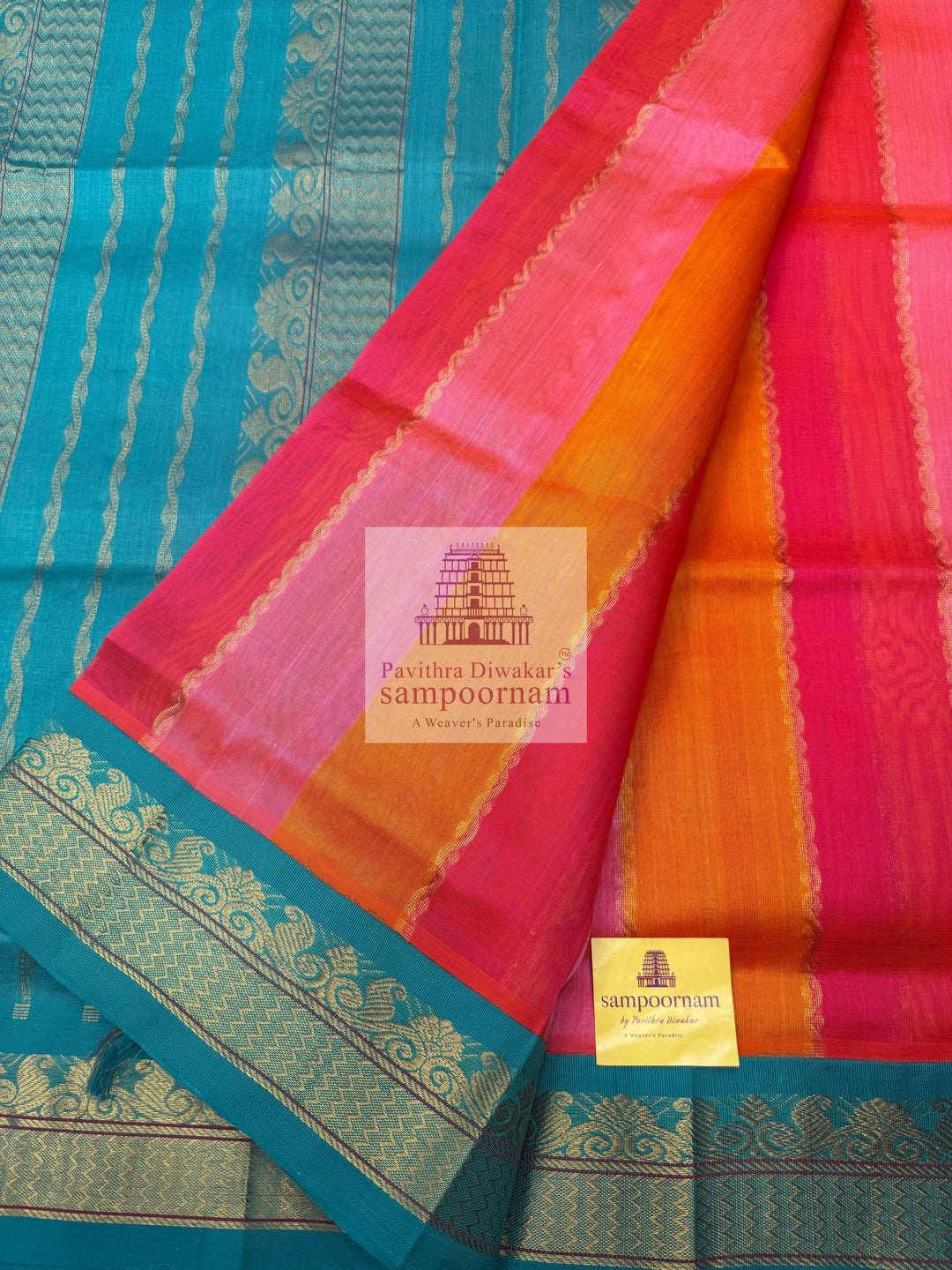 A fusion of colours, pink, orange, peach and turquoise blue, with traditional borders and rich pallu Korvai Silk Cotton Saree