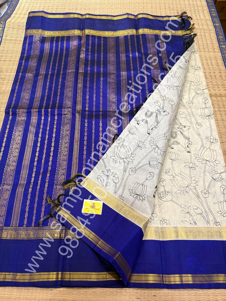 Offwhite with Blue , Pichwai outline print in the body , rettapet border , traditional rich Pallu Printed Korvai Silk Cotton Saree