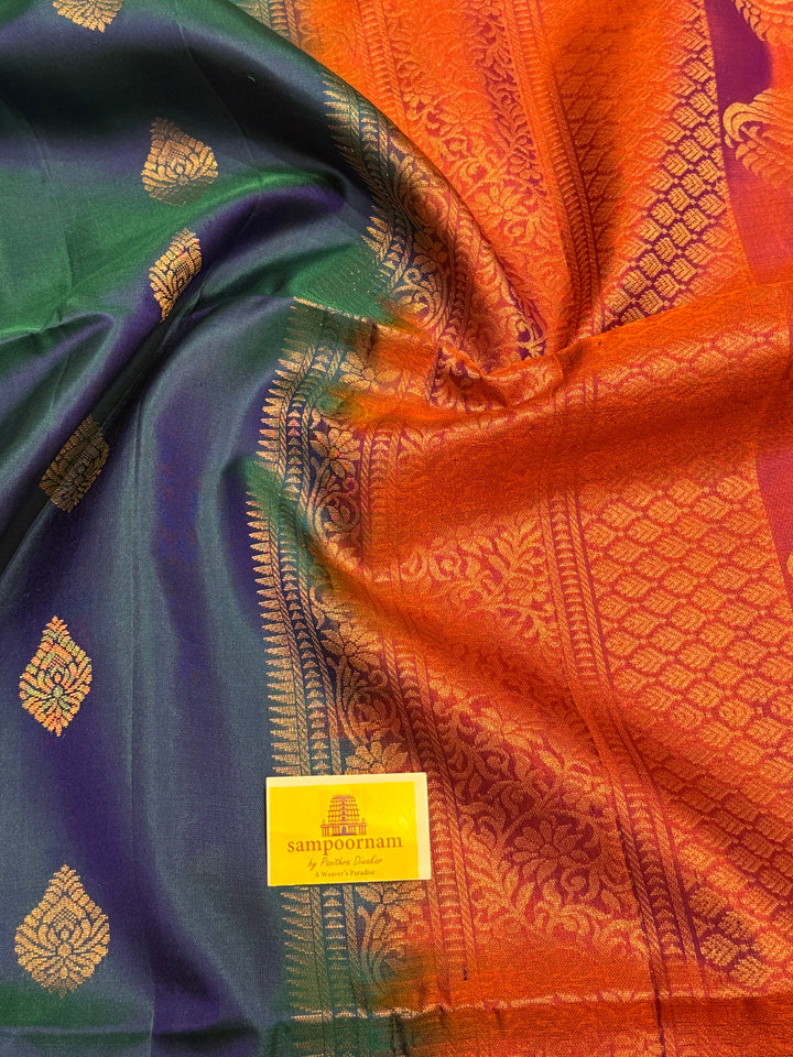 Traditional Mayilkazhuthu Blue with Orangish Pink , Rich Zari Motifs in the Body and Traditional Rich Pallu Pure Soft Silk Saree