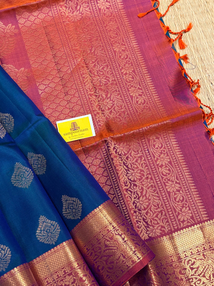 Traditional Mayilkazhuthu Blue with Orangish Pink , Rich Zari Motifs in the Body and Traditional Rich Pallu Pure Soft Silk Saree