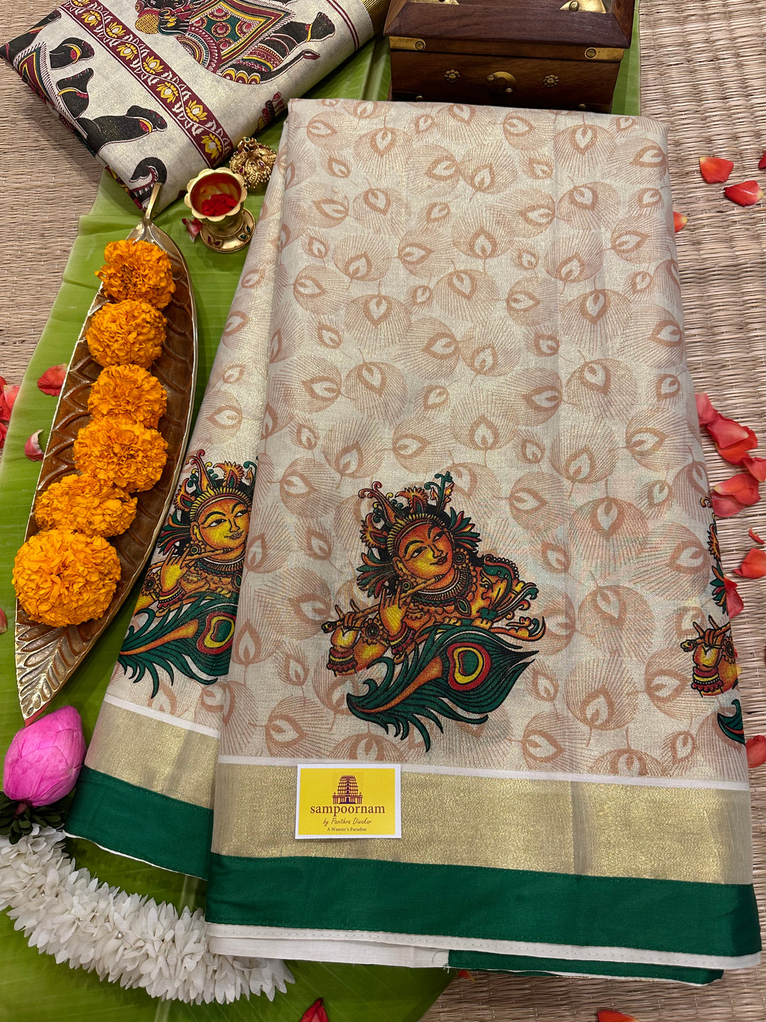 Kerala Tissue Saree with Krishna Flute and Peacock Feather Motif, Allover Peacock Feather Motifs and Green Piping in Border