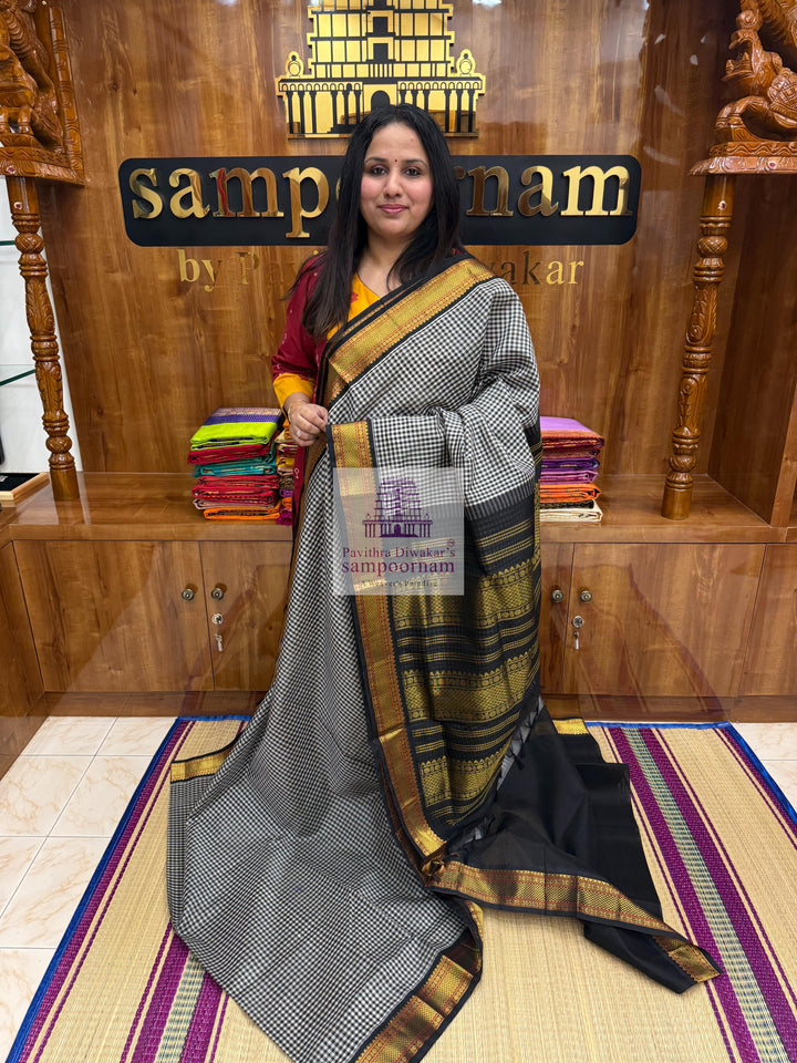 Black white Podi Kattam with Traditional Borders and Rich Pallu Korvai Silk Cotton Saree