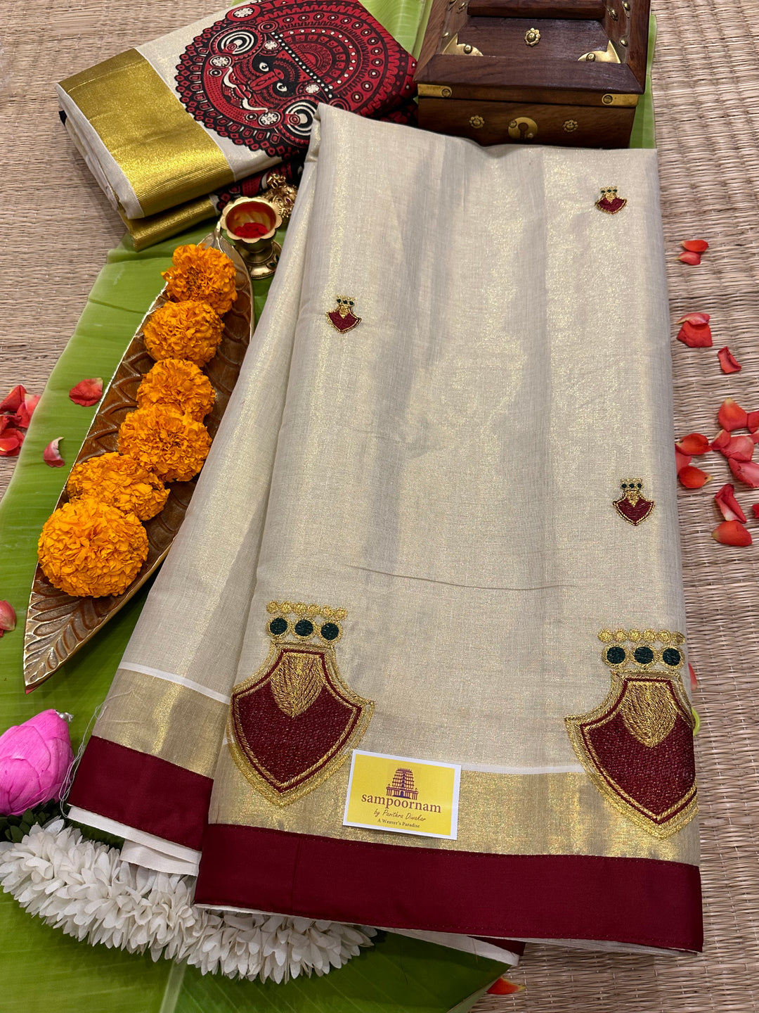 Kerala Tissue Saree with Maroon Palakka Embroidery Motif and Marron Piping in Borders