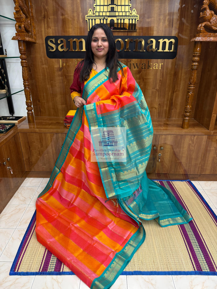 A fusion of colours, pink, orange, peach and turquoise blue, with traditional borders and rich pallu Korvai Silk Cotton Saree