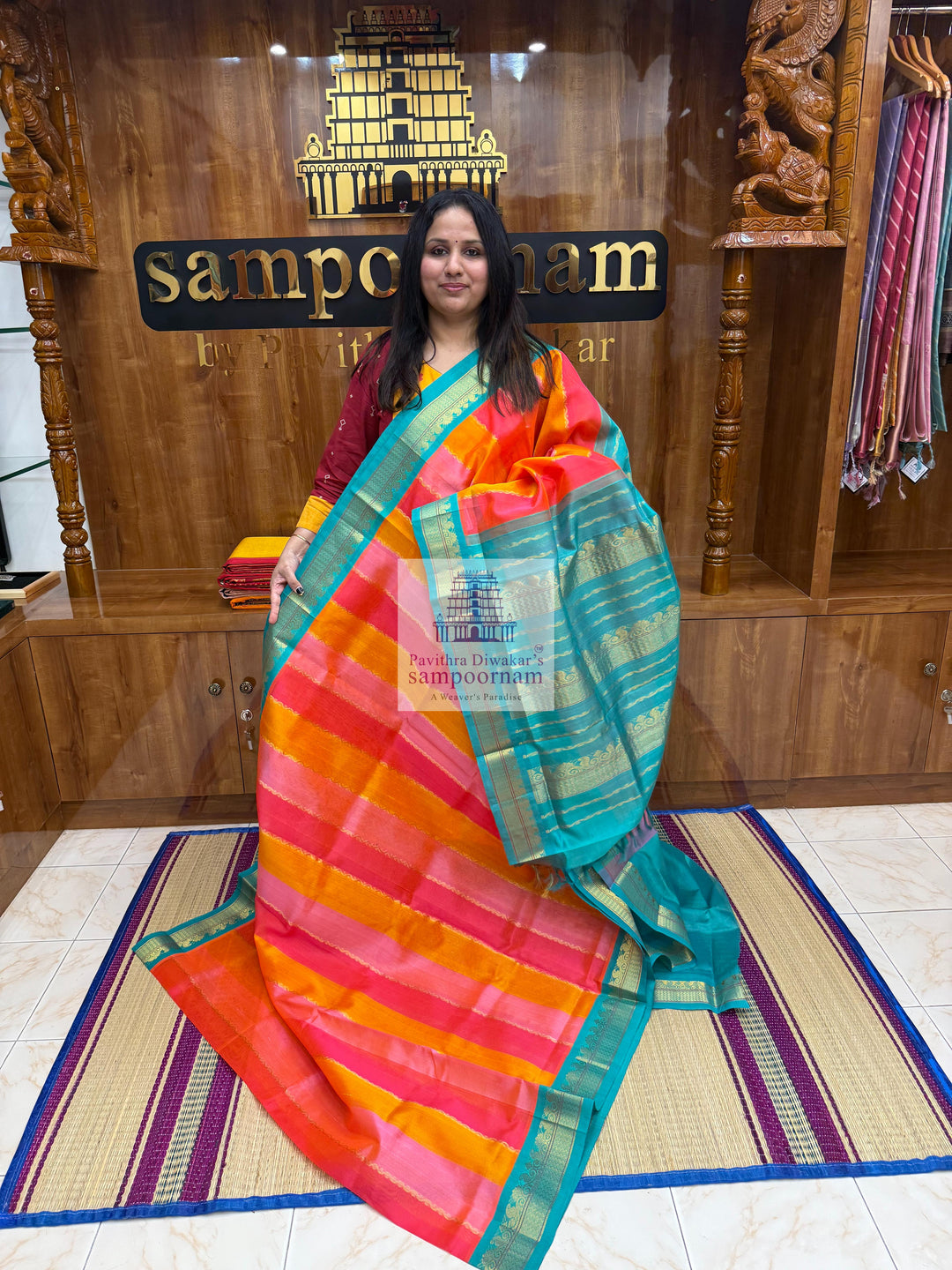 A fusion of colours, pink, orange, peach and turquoise blue, with traditional borders and rich pallu Korvai Silk Cotton Saree