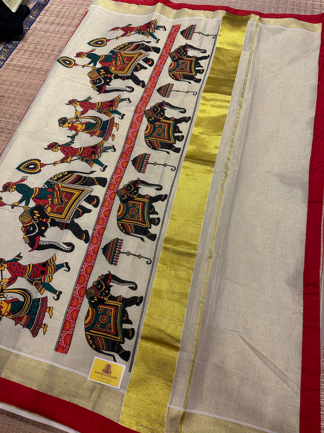 Kerala Tissue Saree with Royal Elephant Procession and Red Border Piping