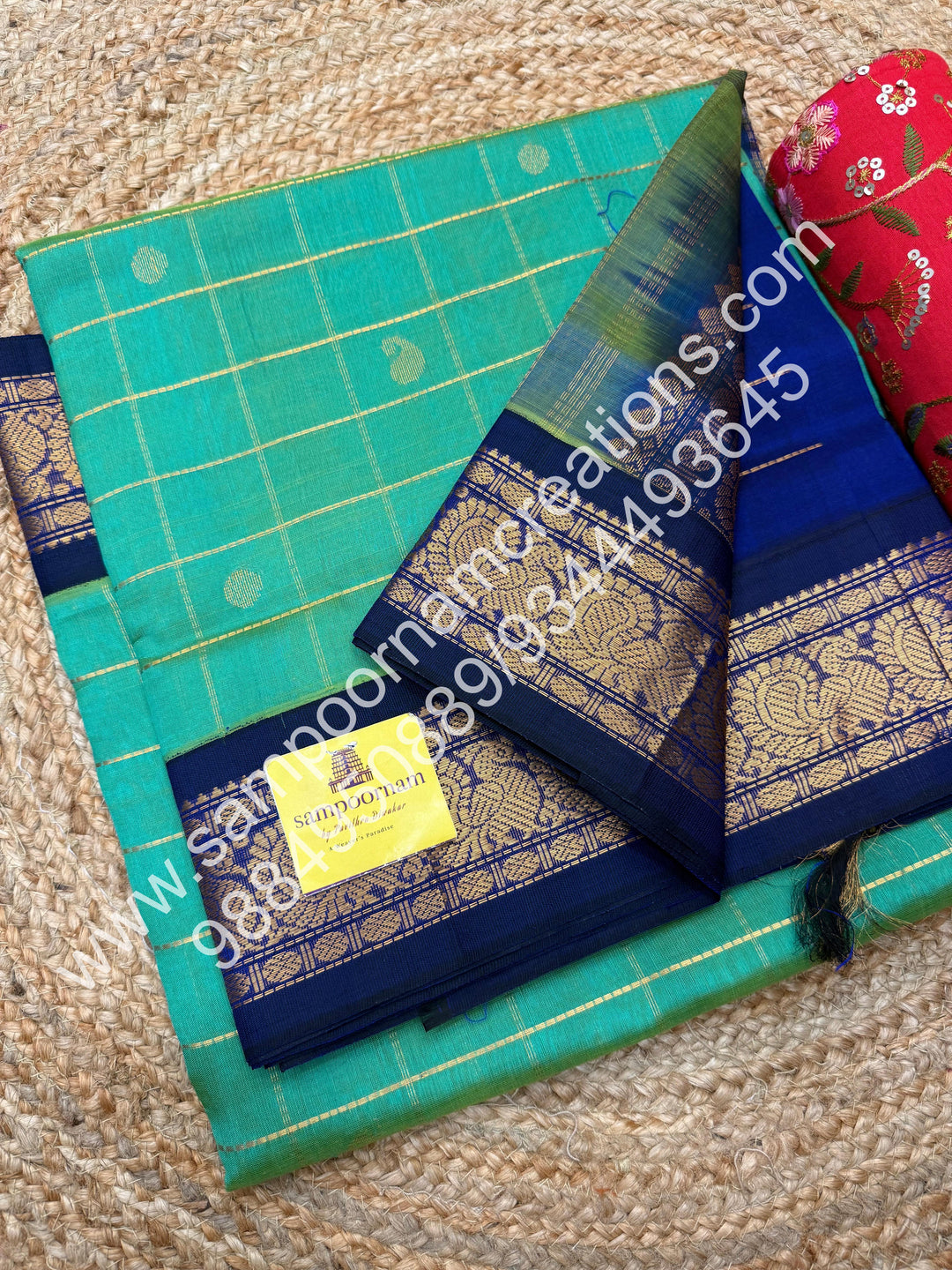 Double Shaded Ramar Blue , rich Zari checks with Mango  butta in the body , traditional  borders  and rich Pallu Korvai Silk Cotton Saree