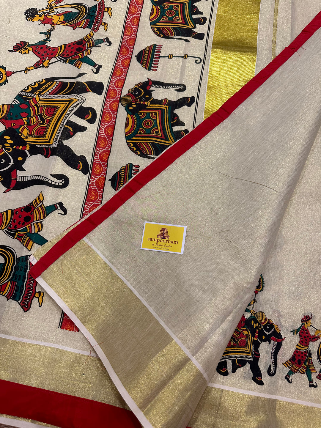 Kerala Tissue Saree with Royal Elephant Procession and Red Border Piping