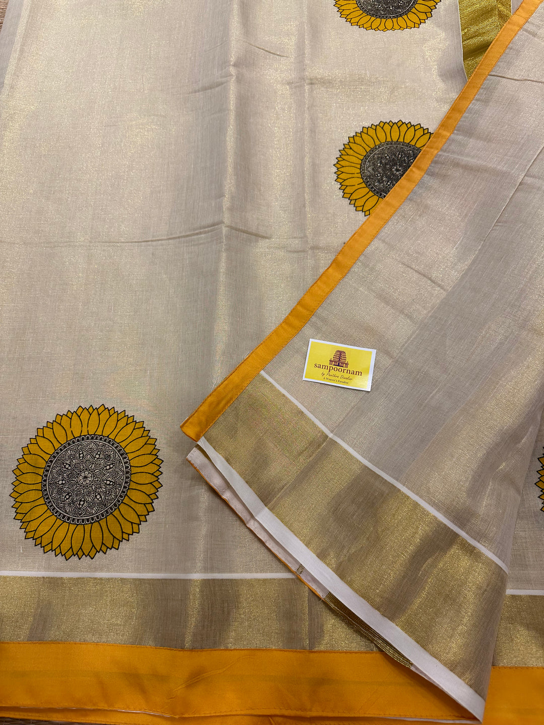 Offwhite Kerala Tissue Saree with Sunflower Motif and With a Yellow Border Piping