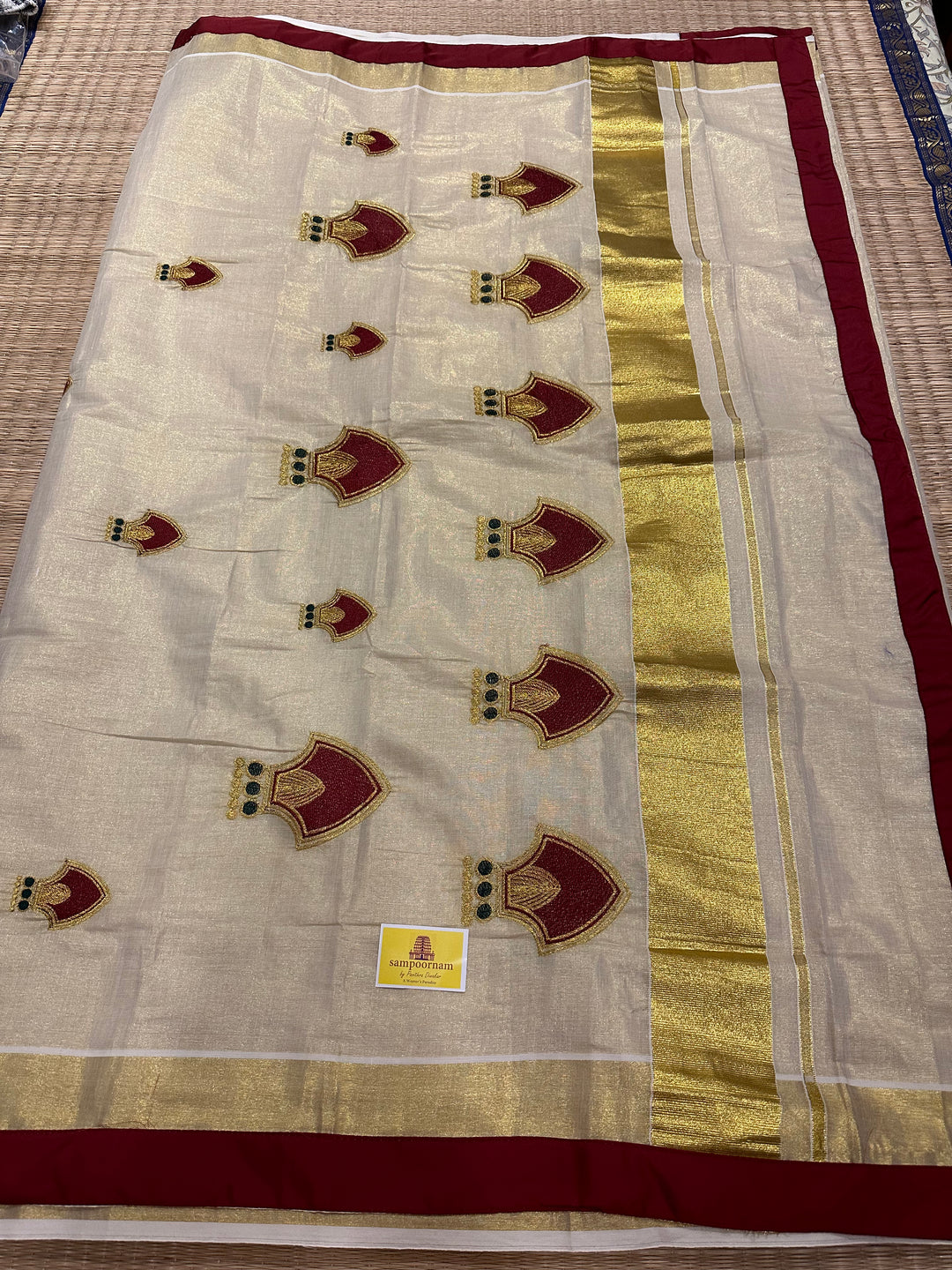 Kerala Tissue Saree with Maroon Palakka Embroidery Motif and Marron Piping in Borders