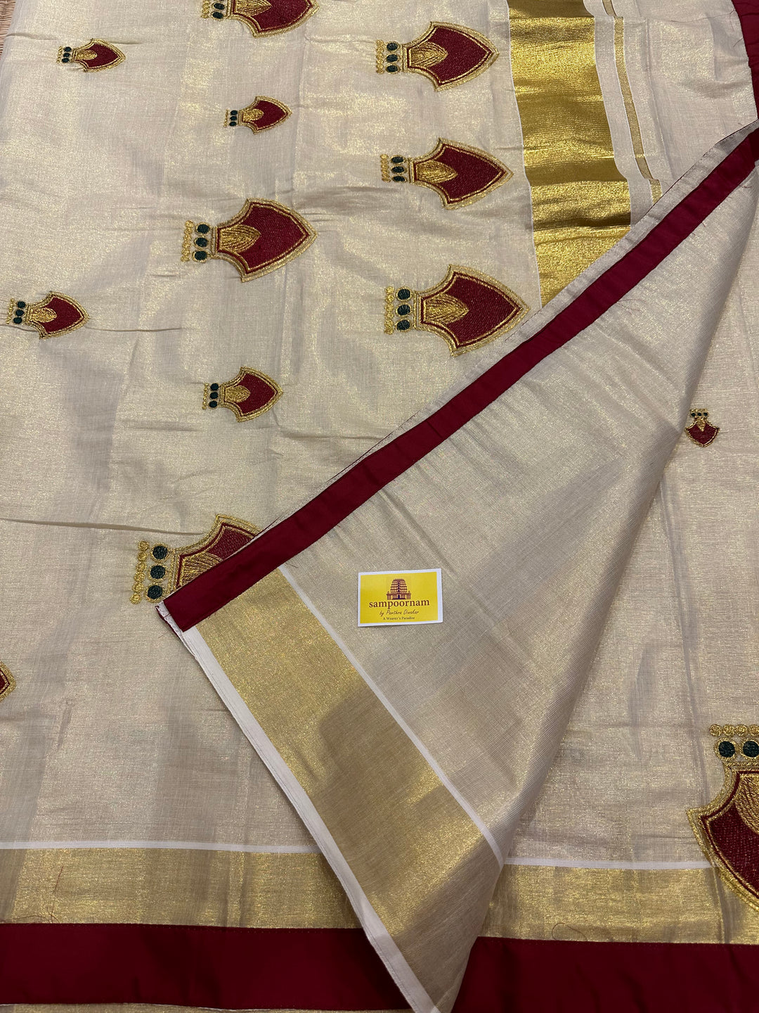 Kerala Tissue Saree with Maroon Palakka Embroidery Motif and Marron Piping in Borders