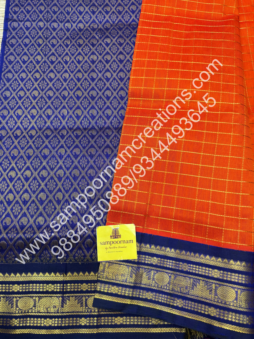 Rust Orange with Dark Blue  , rich Zari checks in the body , traditional borders and rich Pallu Korvai Silk Cotton