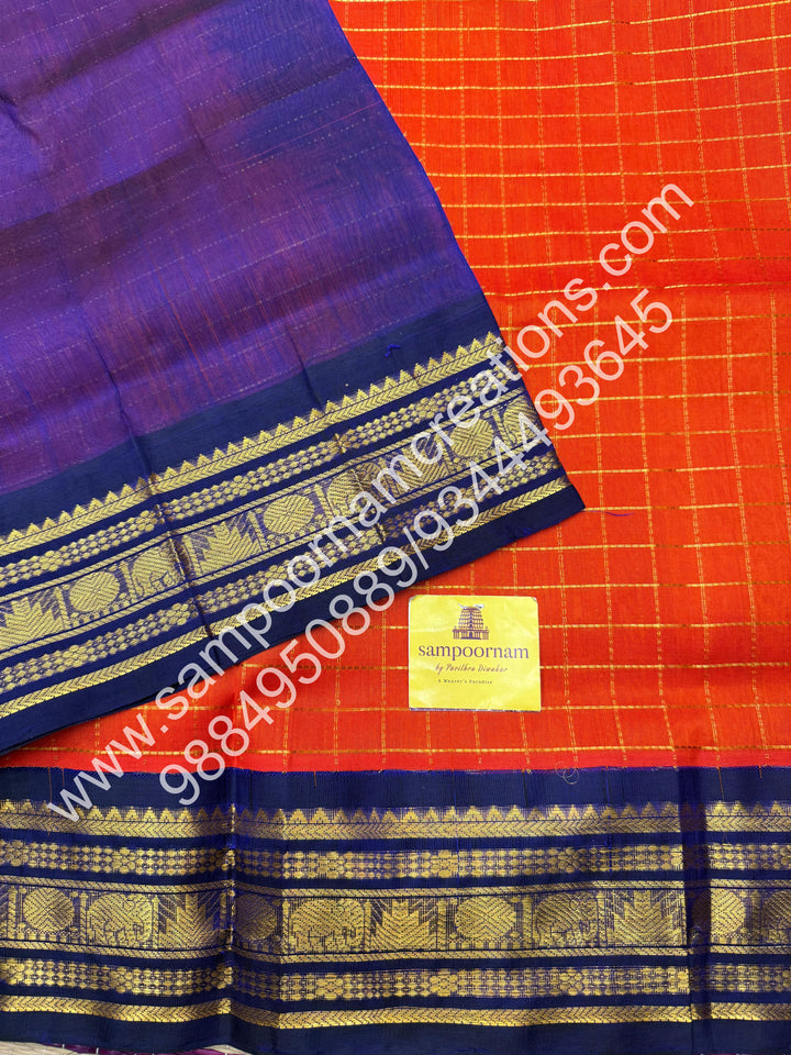Rust Orange with Dark Blue  , rich Zari checks in the body , traditional borders and rich Pallu Korvai Silk Cotton