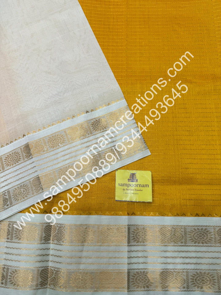 Yellow with Offwhite  , rich Zari checks in the body , rettapet  borders and rich Pallu Korvai Silk Cotton