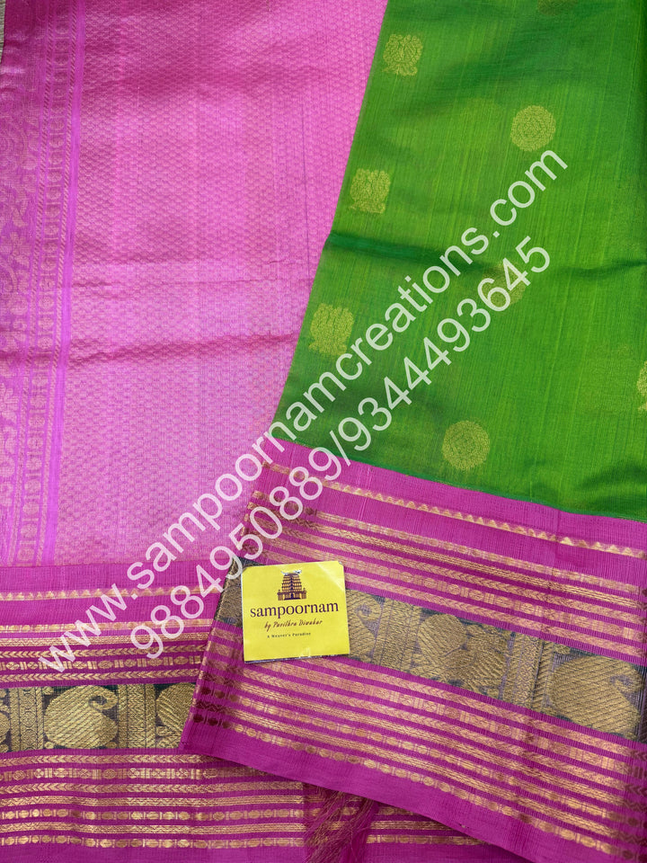 Light Green with Baby Pink , rich Mayil and Chakram zari butta in the body , Kanchi traditional border and  rich Pallu Korvai Silk Cotton Saree