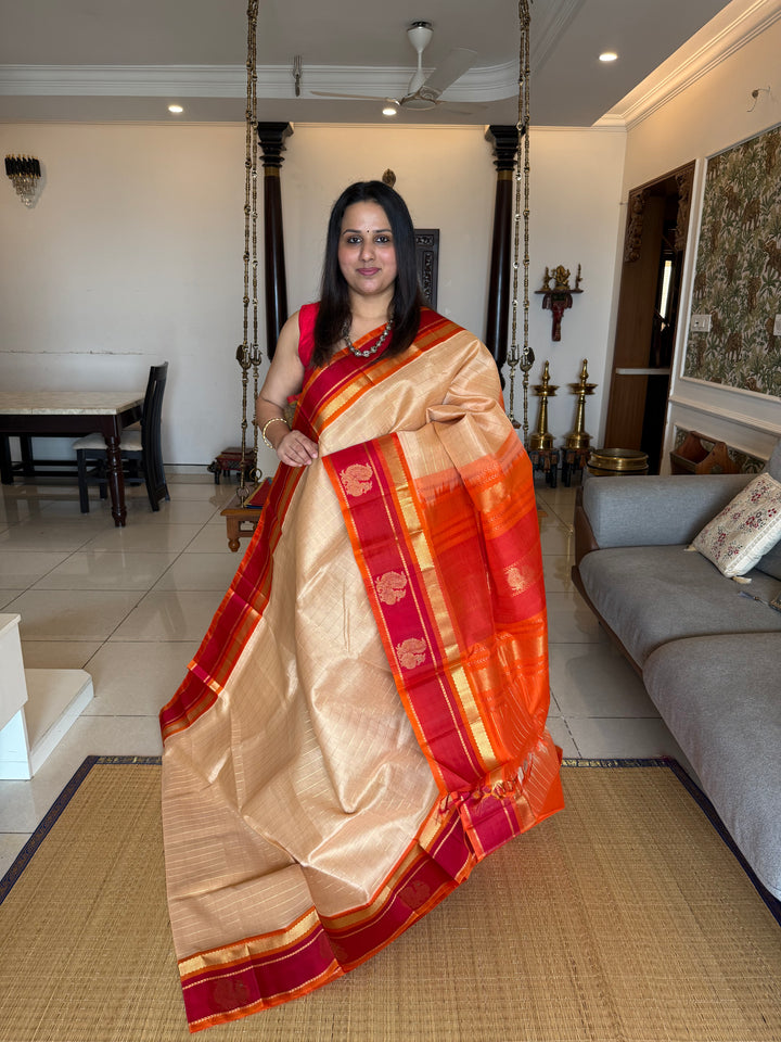 Biscuit Colour with Orange and Red,with Annam Motifs in the Border and Zari checks in the Body and Rich Pallu Korvai Silk Cotton Saree