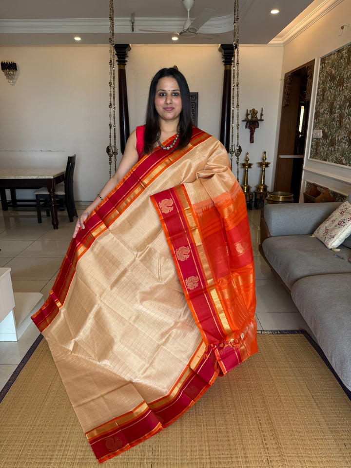 Biscuit Colour with Orange and Red,with Annam Motifs in the Border and Zari checks in the Body and Rich Pallu Korvai Silk Cotton Saree