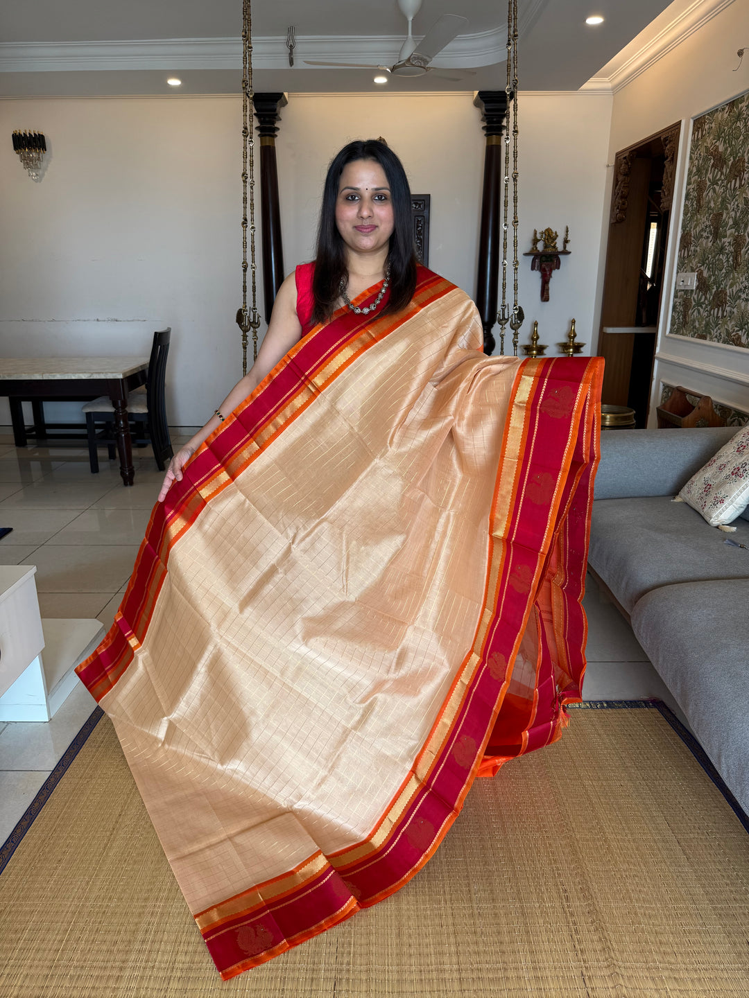 Biscuit Colour with Orange and Red,with Annam Motifs in the Border and Zari checks in the Body and Rich Pallu Korvai Silk Cotton Saree