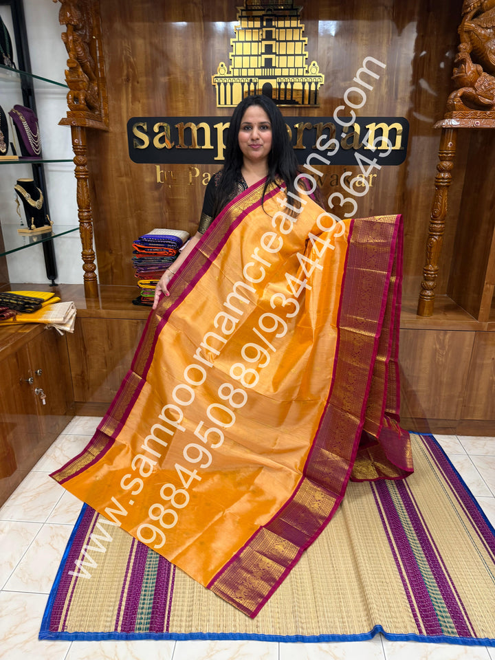 Peach with Dark Magenta , Floral  Zari butta in the body , One side big kanchi border and rich Pallu Korvai Silk Cotton Saree