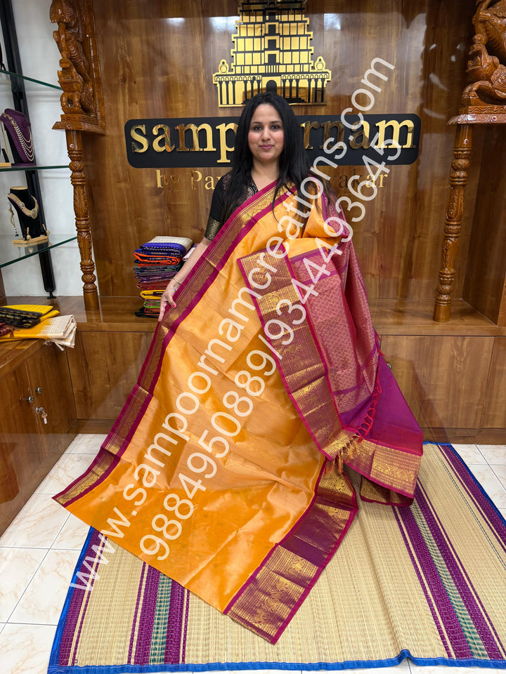 Peach with Dark Magenta , Floral  Zari butta in the body , One side big kanchi border and rich Pallu Korvai Silk Cotton Saree