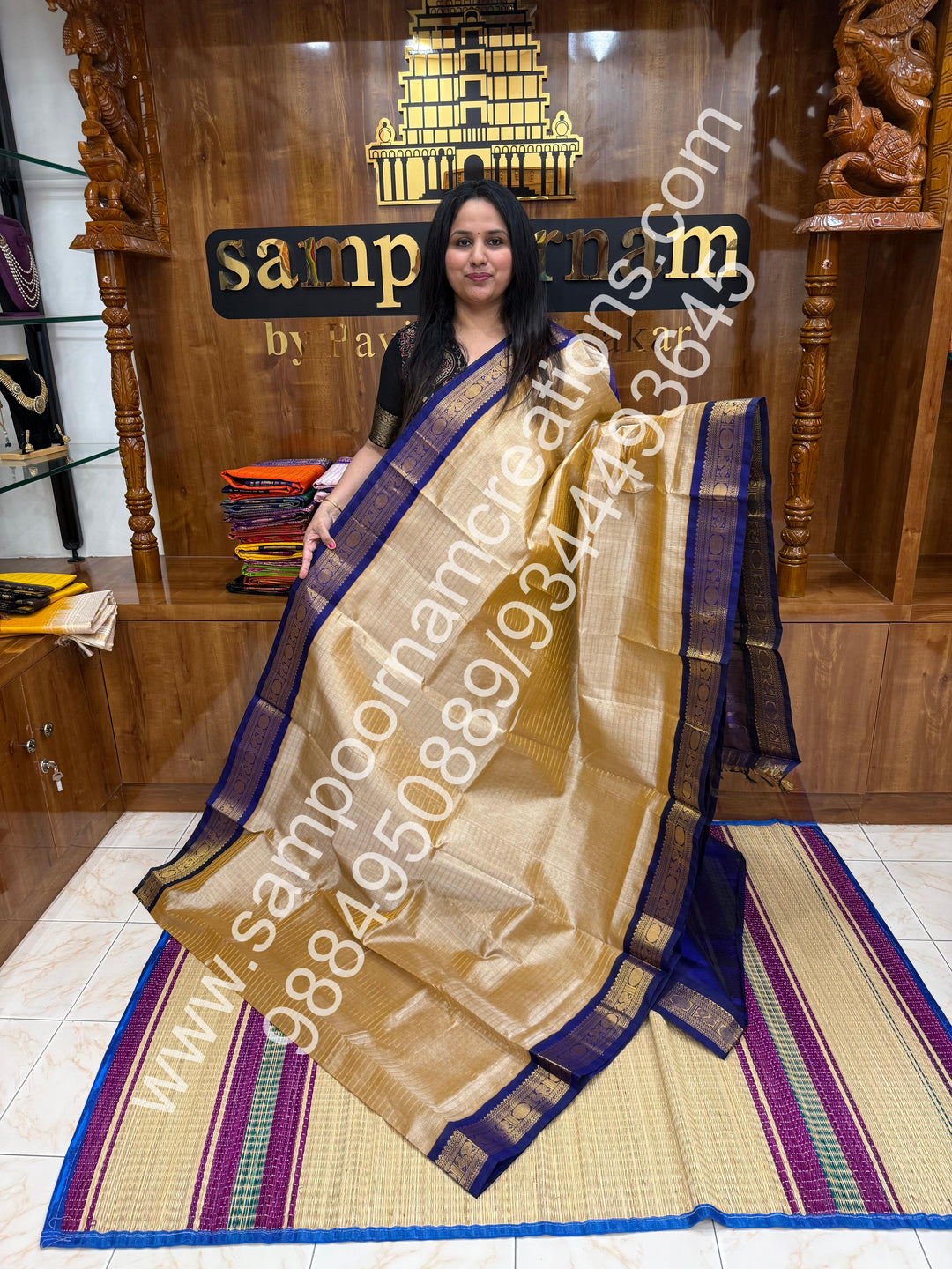 Beige with Dark Blue  , rich Zari checks in the body , traditional borders and rich Pallu Korvai Silk Cotton