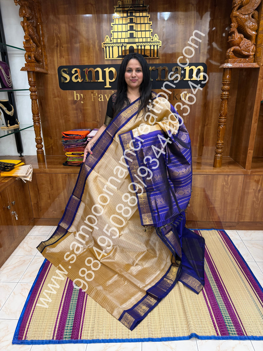Beige with Dark Blue  , rich Zari checks in the body , traditional borders and rich Pallu Korvai Silk Cotton