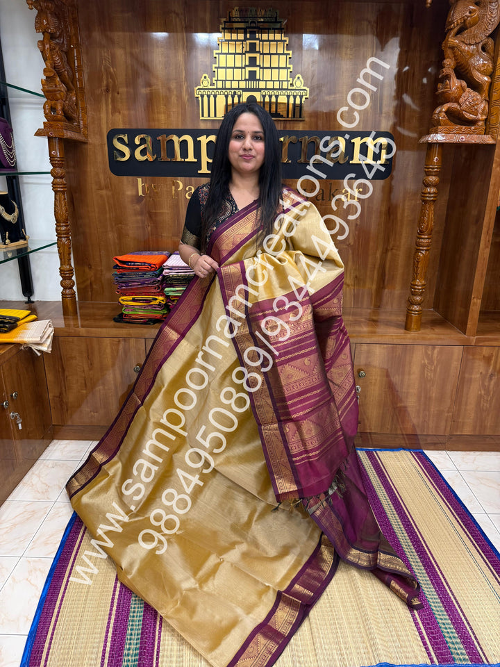 Gold with Wine , Vairaoosi Zari Lines in the body , Traditional borders and rich Pallu Korvai Silk Cotton