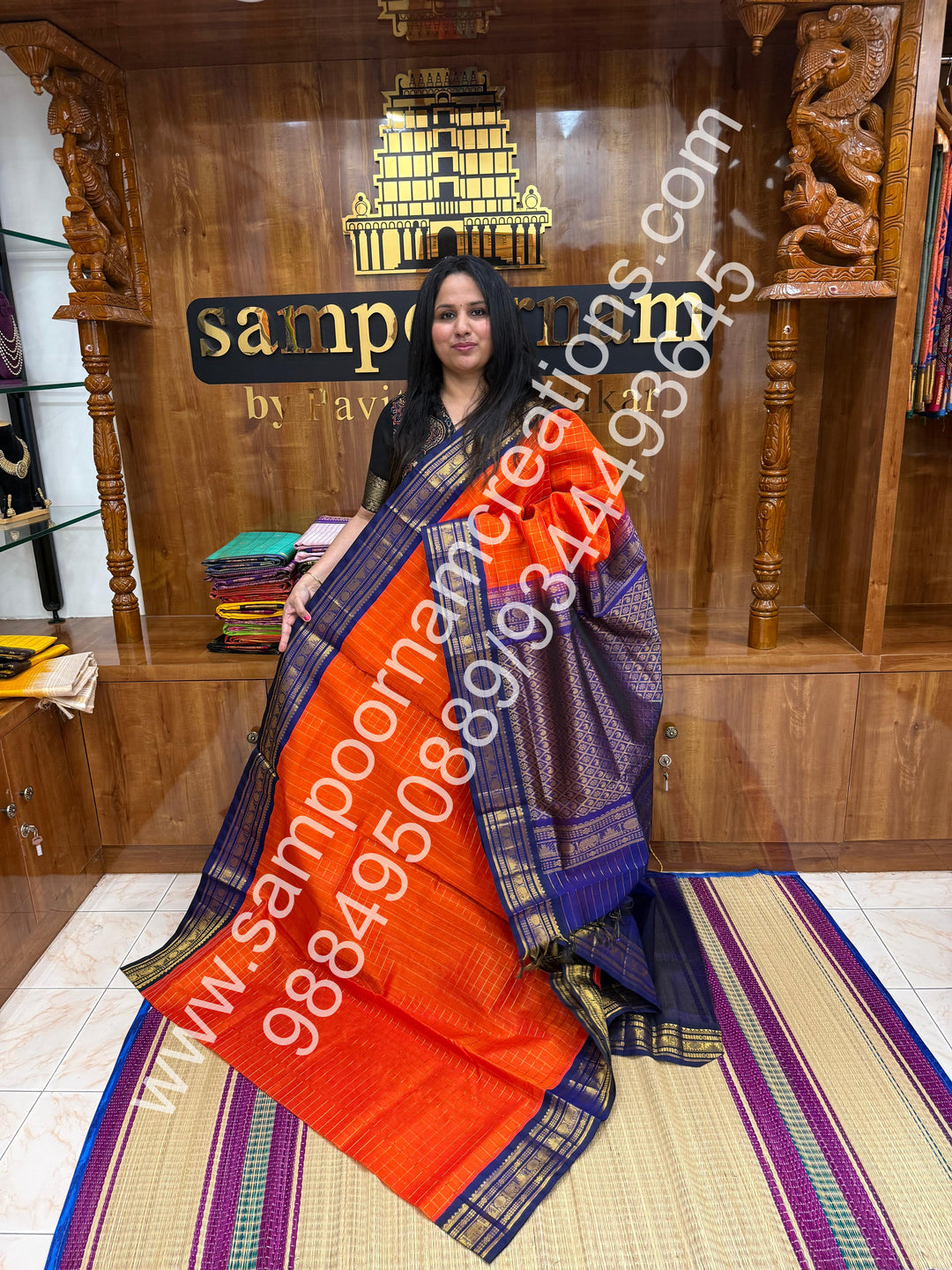 Rust Orange with Dark Blue  , rich Zari checks in the body , traditional borders and rich Pallu Korvai Silk Cotton