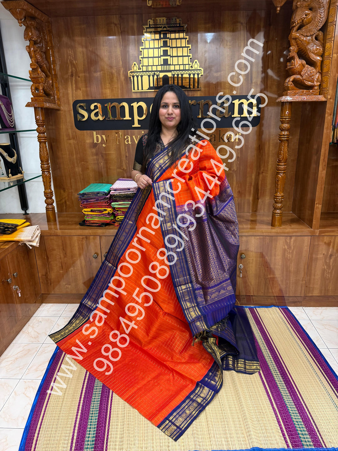 Rust Orange with Dark Blue  , rich Zari checks in the body , traditional borders and rich Pallu Korvai Silk Cotton