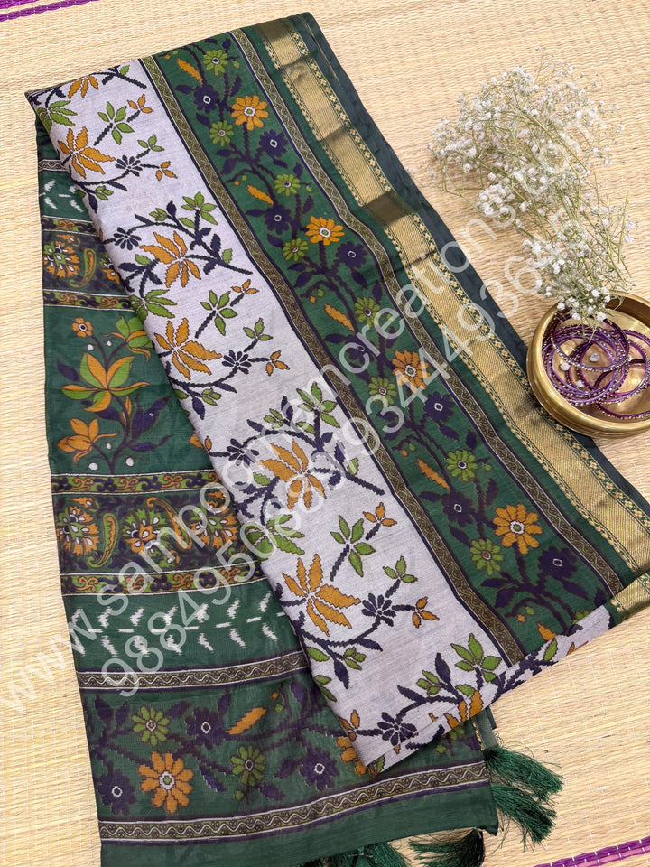 Grey with Green  , Floral Prints in the body , Printed Blouse and Tassels in the Pallu , Soft Cotton Saree