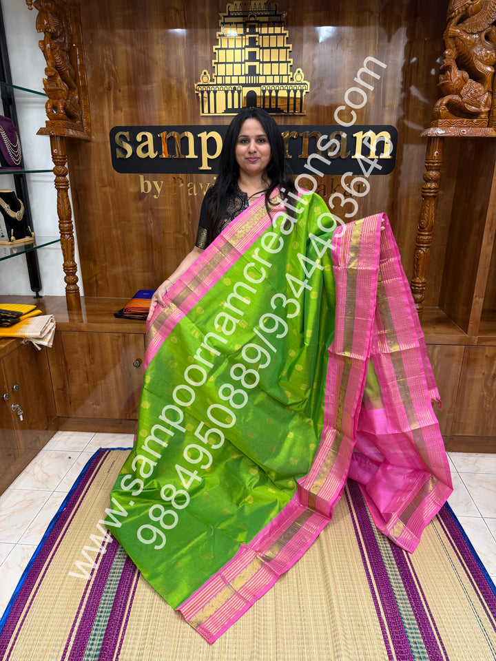 Light Green with Baby Pink , rich Mayil and Chakram zari butta in the body , Kanchi traditional border and  rich Pallu Korvai Silk Cotton Saree