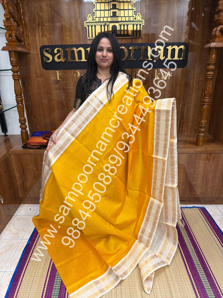 Yellow with Offwhite  , rich Zari checks in the body , rettapet  borders and rich Pallu Korvai Silk Cotton