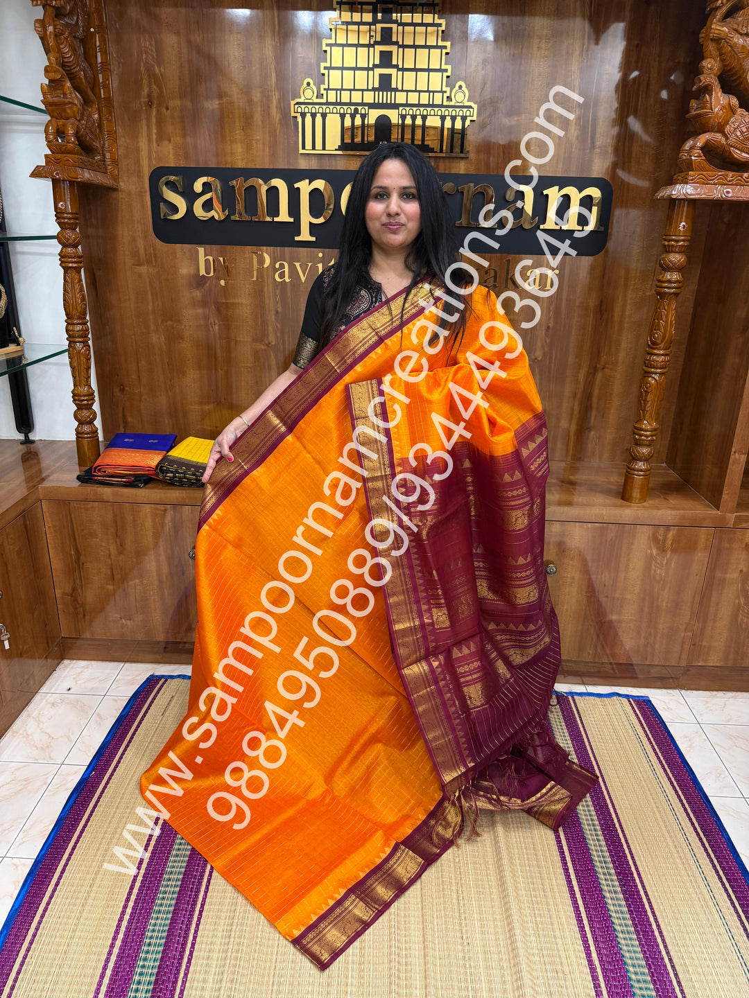 Kanakambaram with Maroon  , rich Zari checks in the body , traditional borders with temple design  and rich Pallu Korvai Silk Cotton