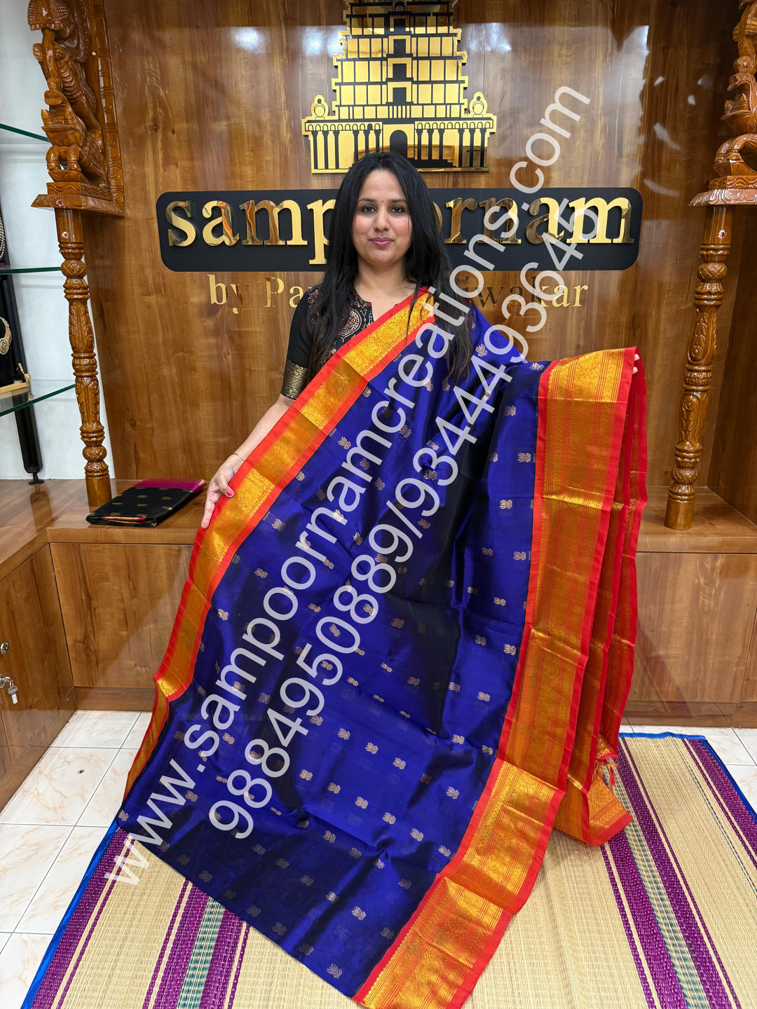 MS Blue with Orange and red selvedge , Lotus Zari butta in the body , One side big border and rich Pallu Korvai Silk Cotton Saree