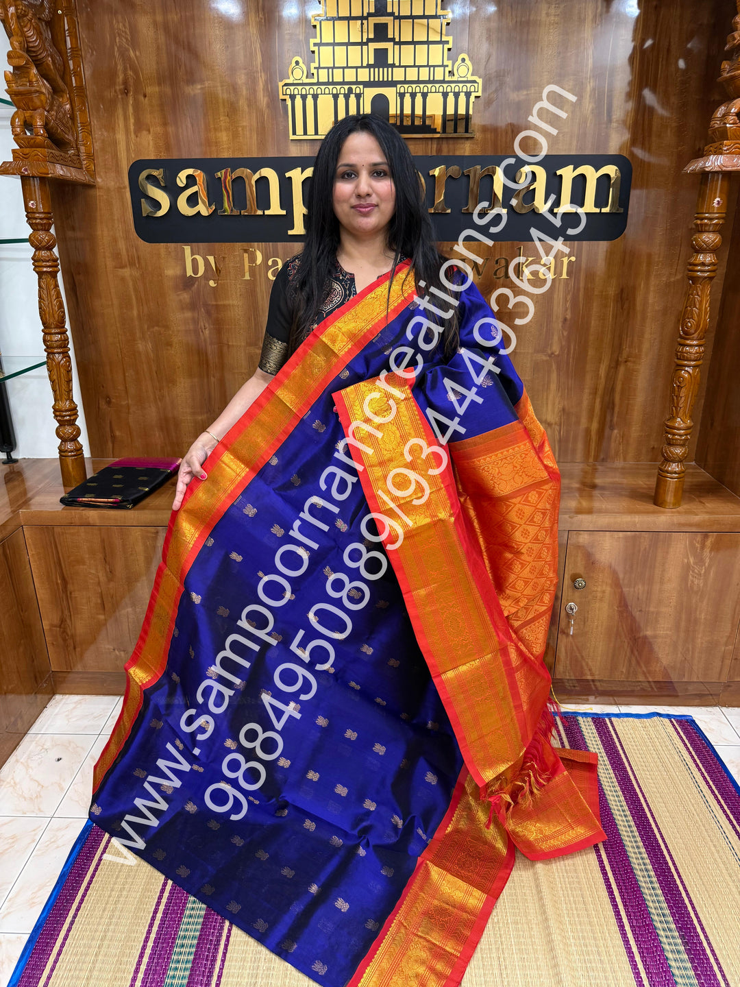 MS Blue with Orange and red selvedge , Lotus Zari butta in the body , One side big border and rich Pallu Korvai Silk Cotton Saree