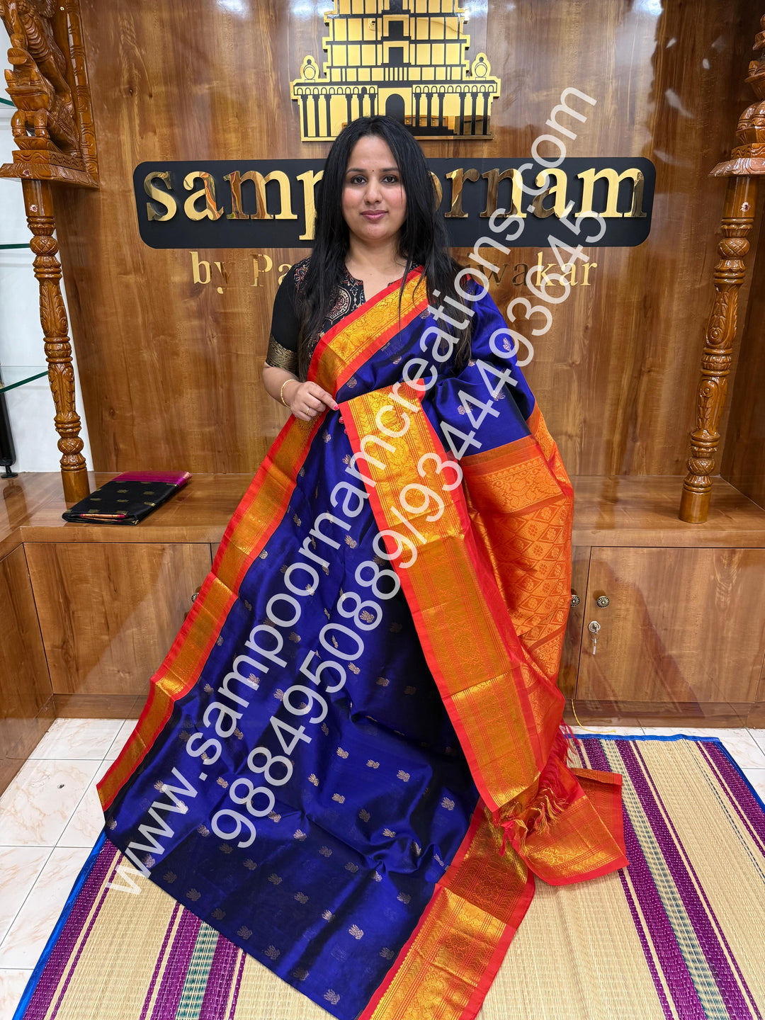 MS Blue with Orange and red selvedge , Lotus Zari butta in the body , One side big border and rich Pallu Korvai Silk Cotton Saree