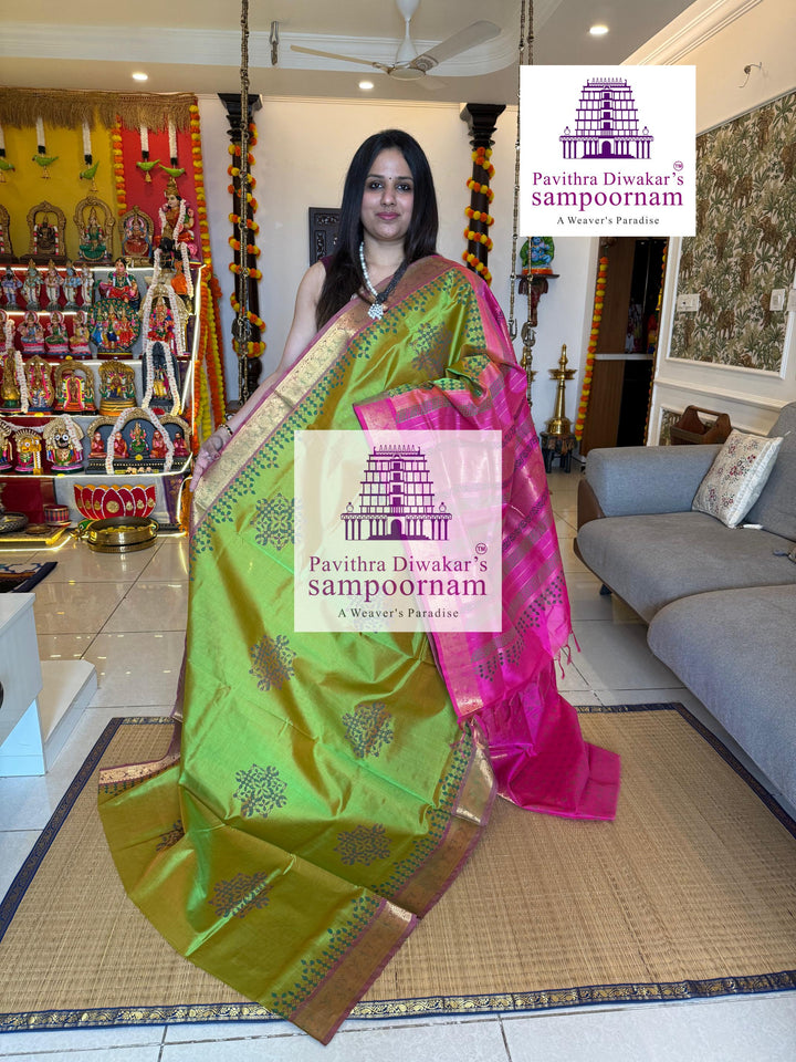Light Green with Pink , with rich Zari Butta in the Body ,traditional borders and rich Pallu silk cotton saree