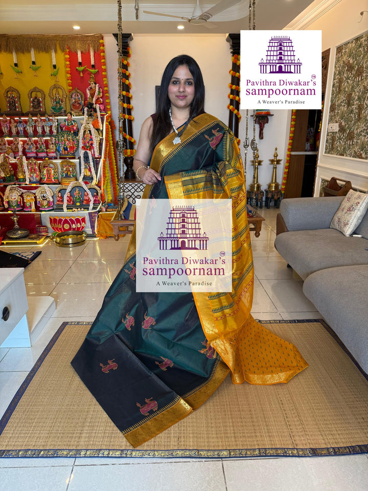 Green with Mustard , Vairaoosi Zari lines in the body , rich zari butta in the body , traditional borders and rich pallu , Terracota horse printed Silk Cotton Saree