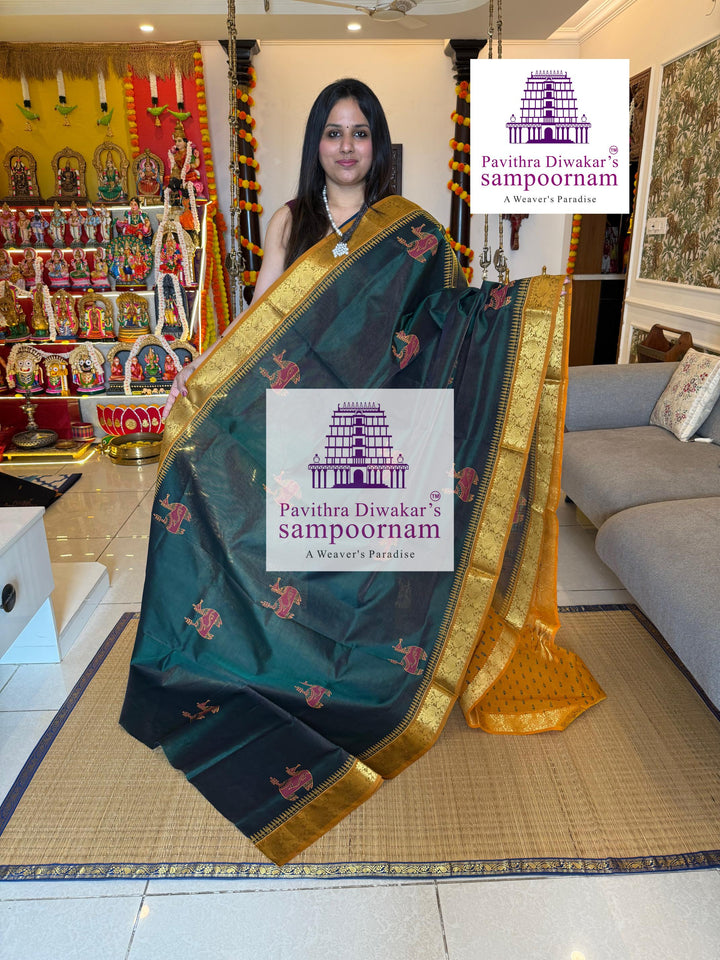 Green with Mustard , Vairaoosi Zari lines in the body , rich zari butta in the body , traditional borders and rich pallu , Terracota horse printed Silk Cotton Saree