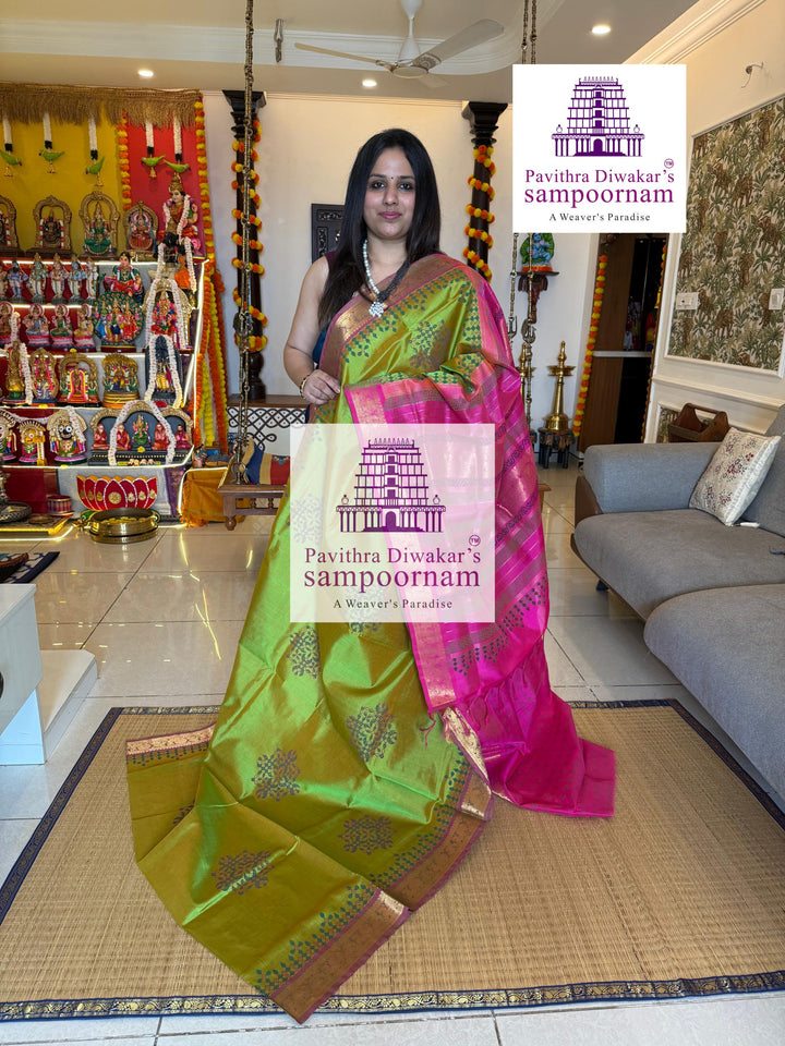 Light Green with Pink , with rich Zari Butta in the Body ,traditional borders and rich Pallu silk cotton saree