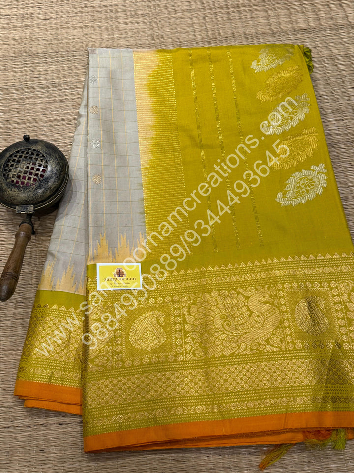 Offwhite with Lemon Green, Orange Selvedge, Rich Zari Checks in the body,Rudraksh Silver and Gold Zari Butta in the Body, Traditional Rich Borders with Temple Design and Grand Pallu, Pure Handloom Gadwal Silk Saree