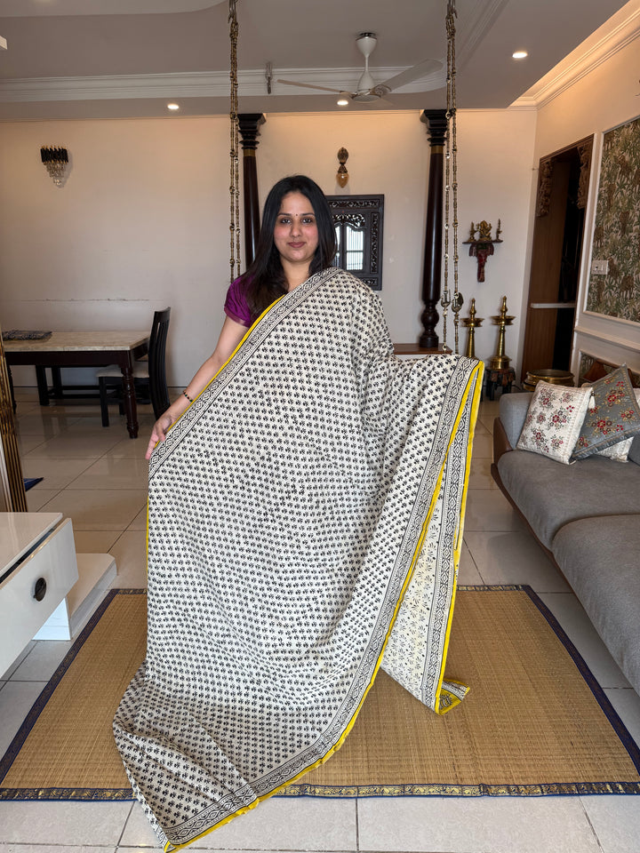 Off white with mustard , floral hand block printed mul cotton saree