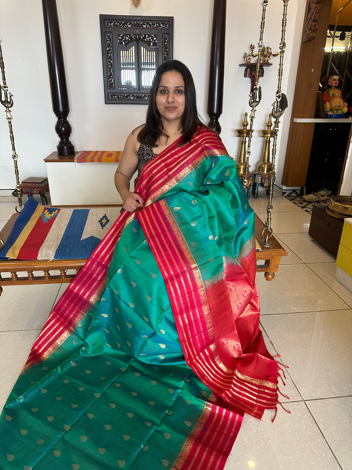 Ramar Blue with Red , Rich Zari lines in the body with Rich Butta and Grand border and Pallu , Pure Soft Silk Saree