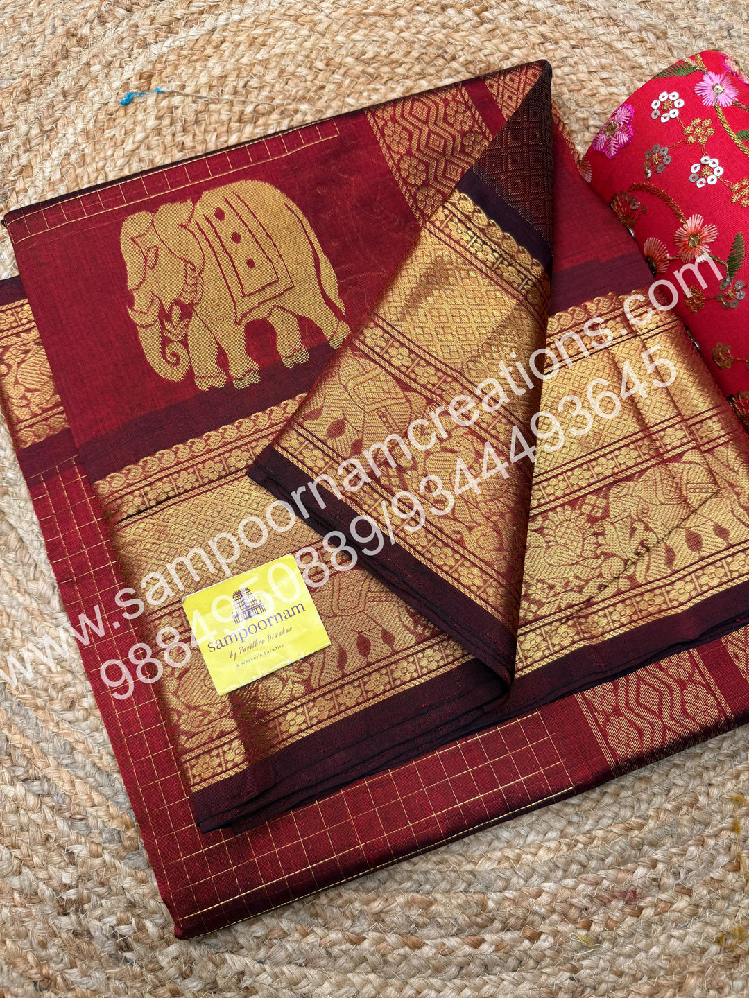 Maroon  Elegant Elephant zari buttu in the borders , zari checks in the body and rich Pallu Silk Cotton Saree