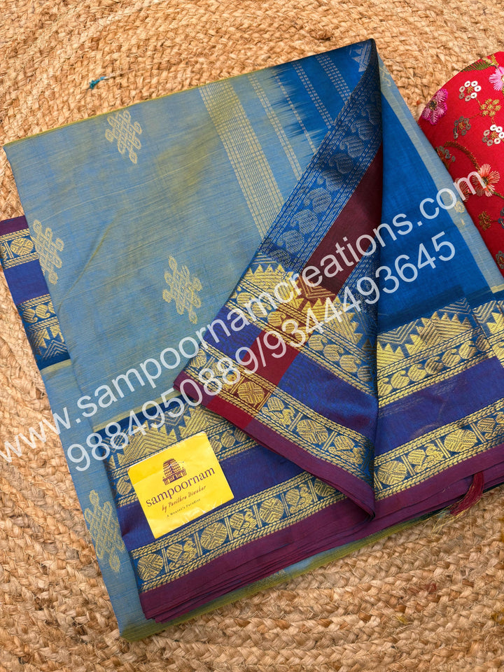 Double Shaded Ramar Green with Blue , rich Kolam Zari butta in the body , rettapet borders  and Grand Pallu Silk Cotton Saree