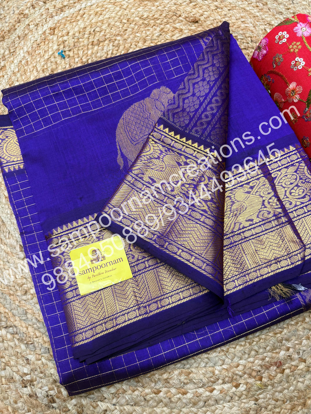 Violet Elegant Elephant zari buttu in the borders , zari checks in the body and rich Pallu Silk Cotton Saree
